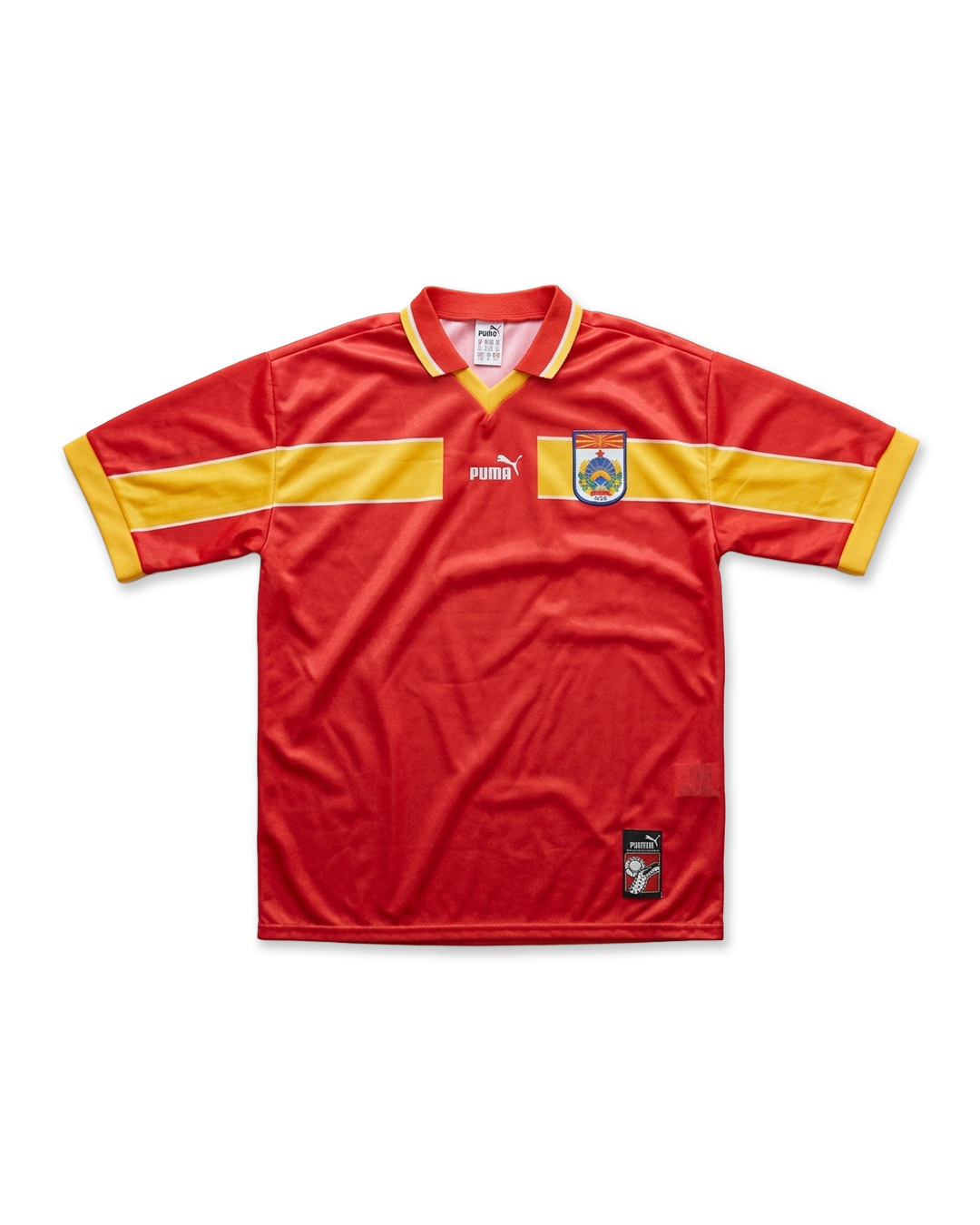Red Macedonian football jersey with yellow sleeve stripes